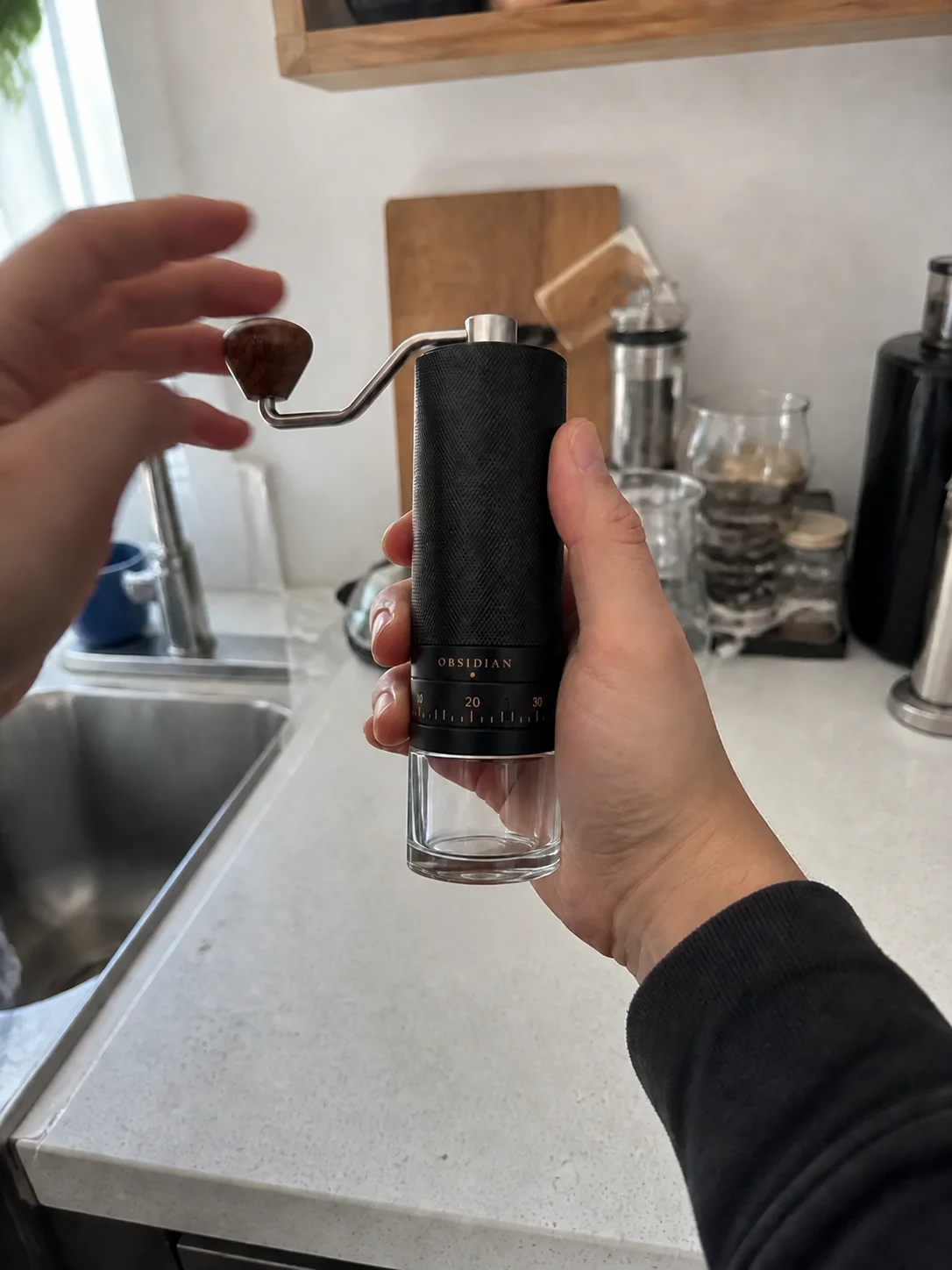 Simulated amateur phone photograph attempting to show the fictional Obsidian grinder in use